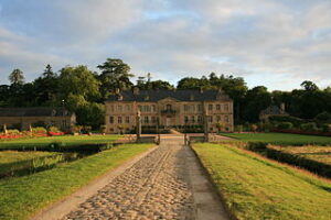 A vintage photo of chateau de Rilly used and representing the themes of financial power and hidden influence explored in “The Kings Have Won.